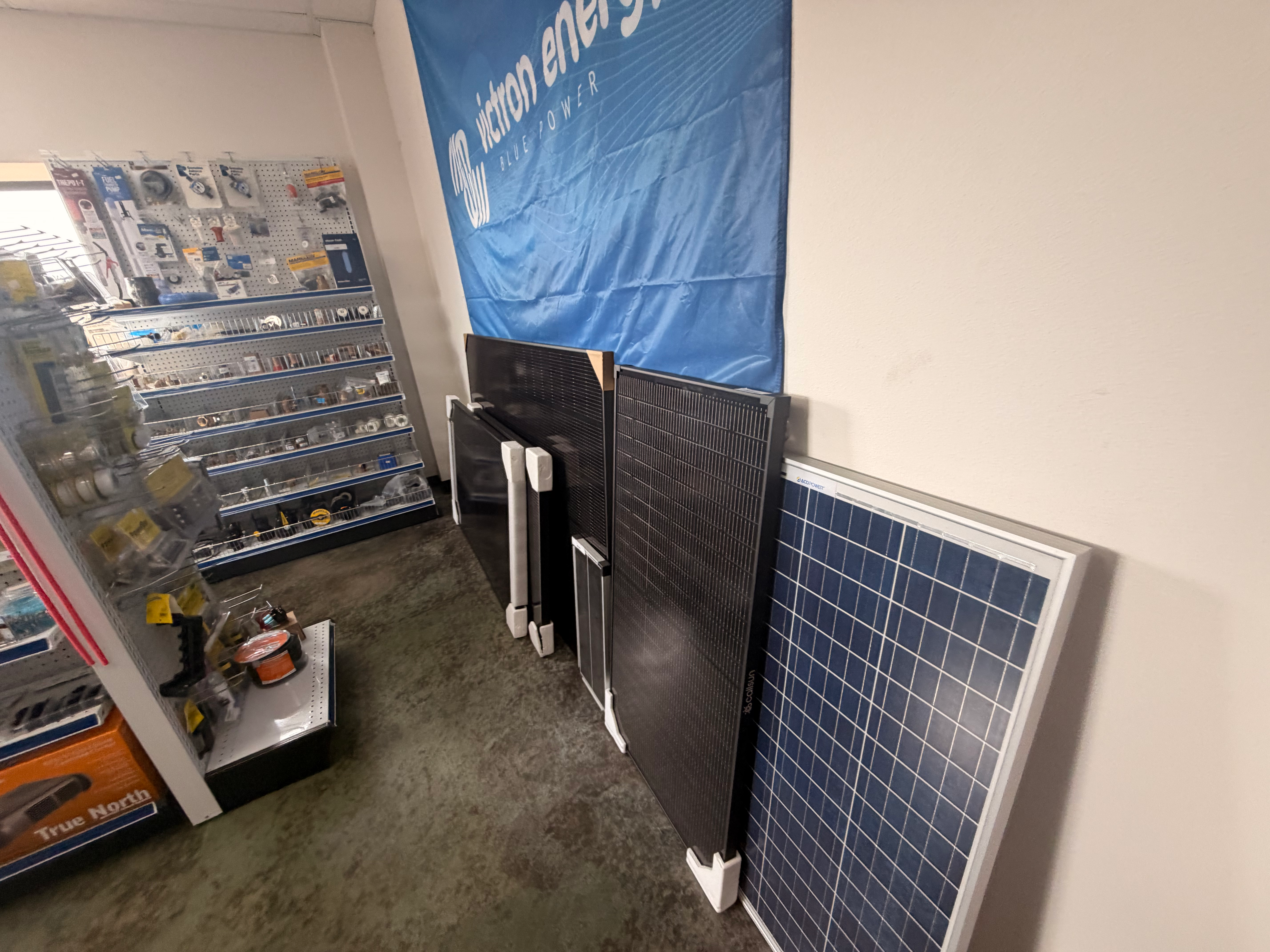 Victron Energy banner and solar panels on display, ESI North Anacortes marine store