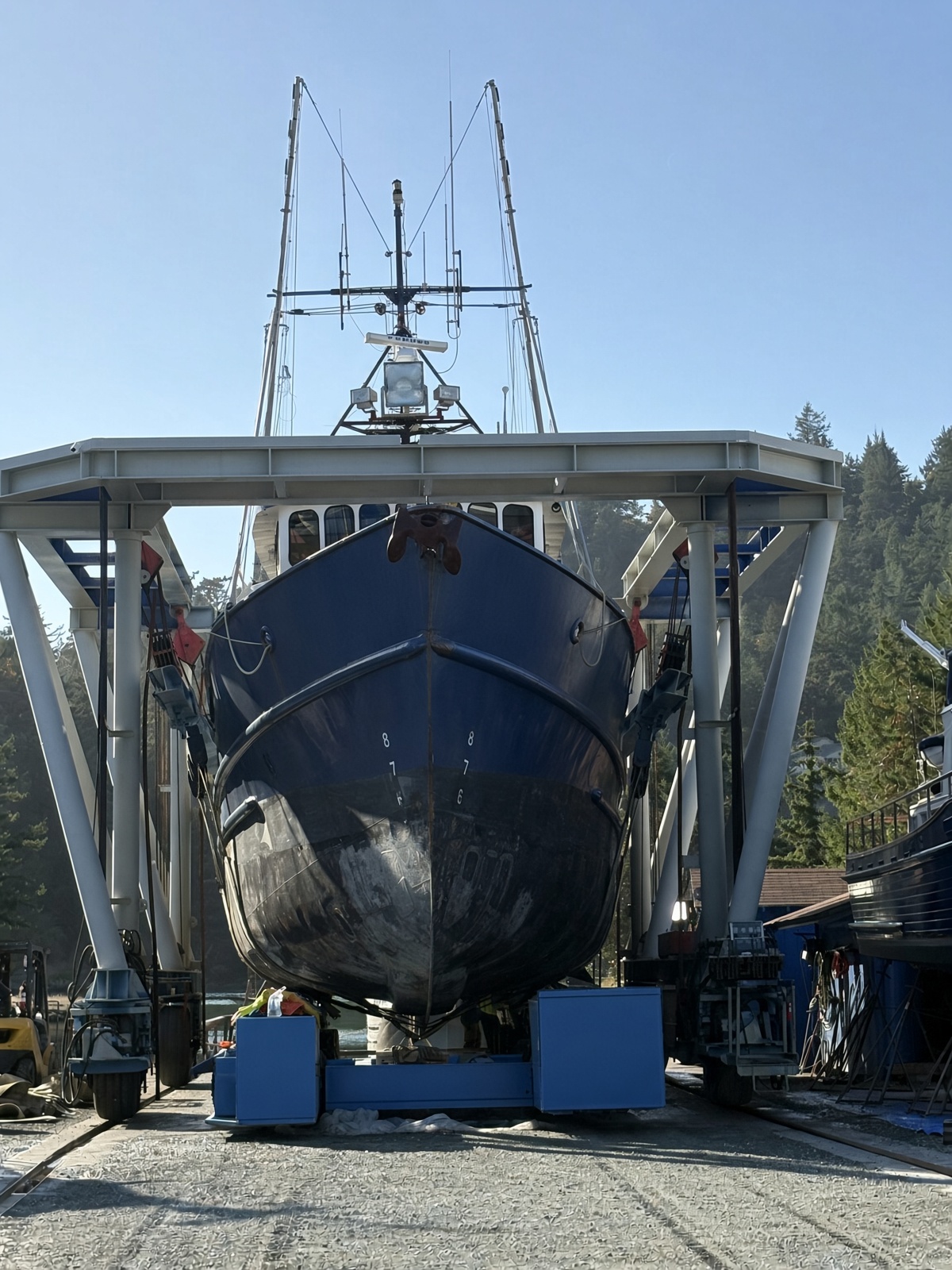 Commercial fishing vessel lifted in the travel lift at Essential Shipyard, La Conner, Washington