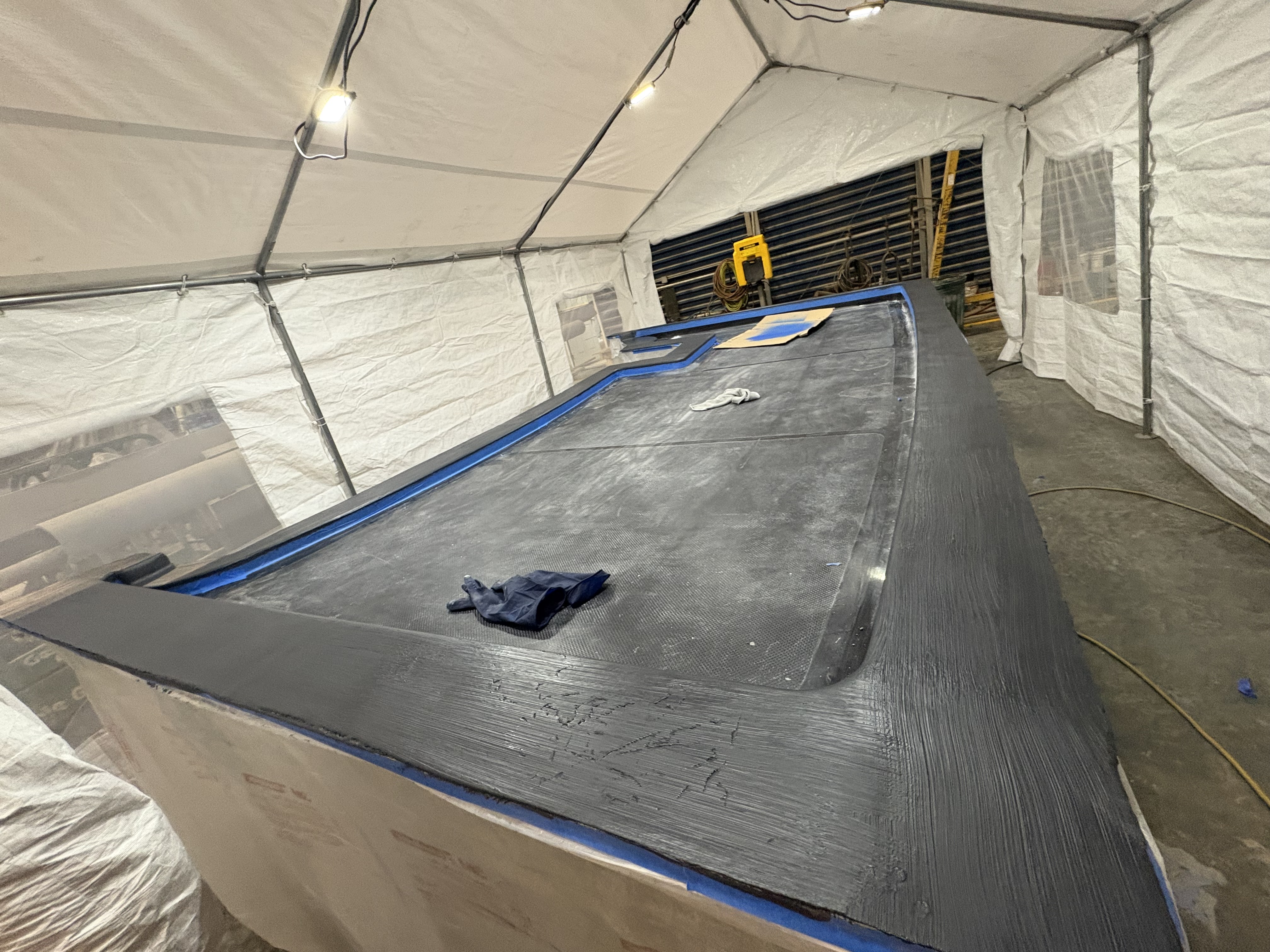 Faired deck taped off before coating, Essential Shipyard