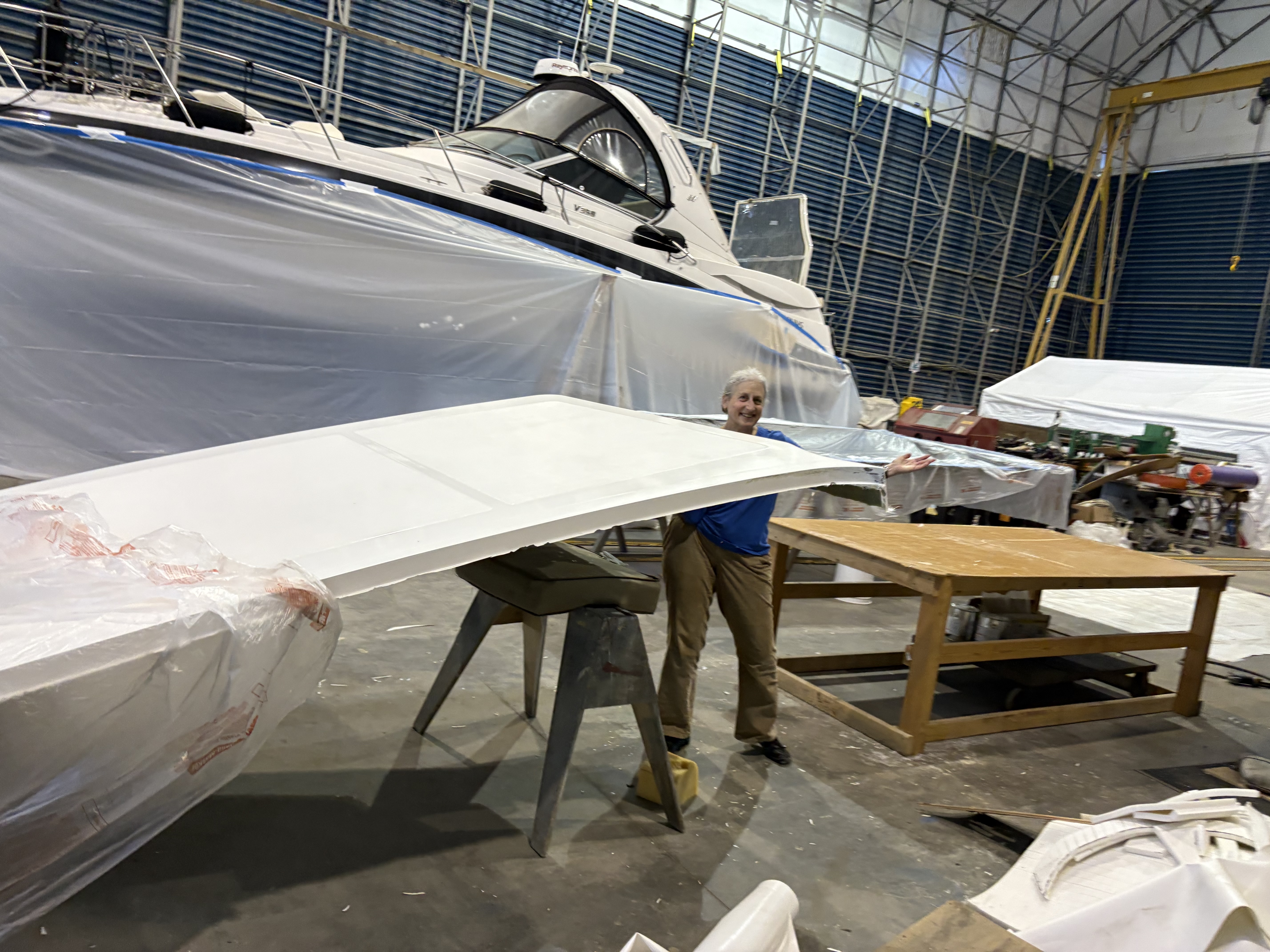 Composite hardtop panel out of the mould, beside the boat it was built for, Essential Shipyard