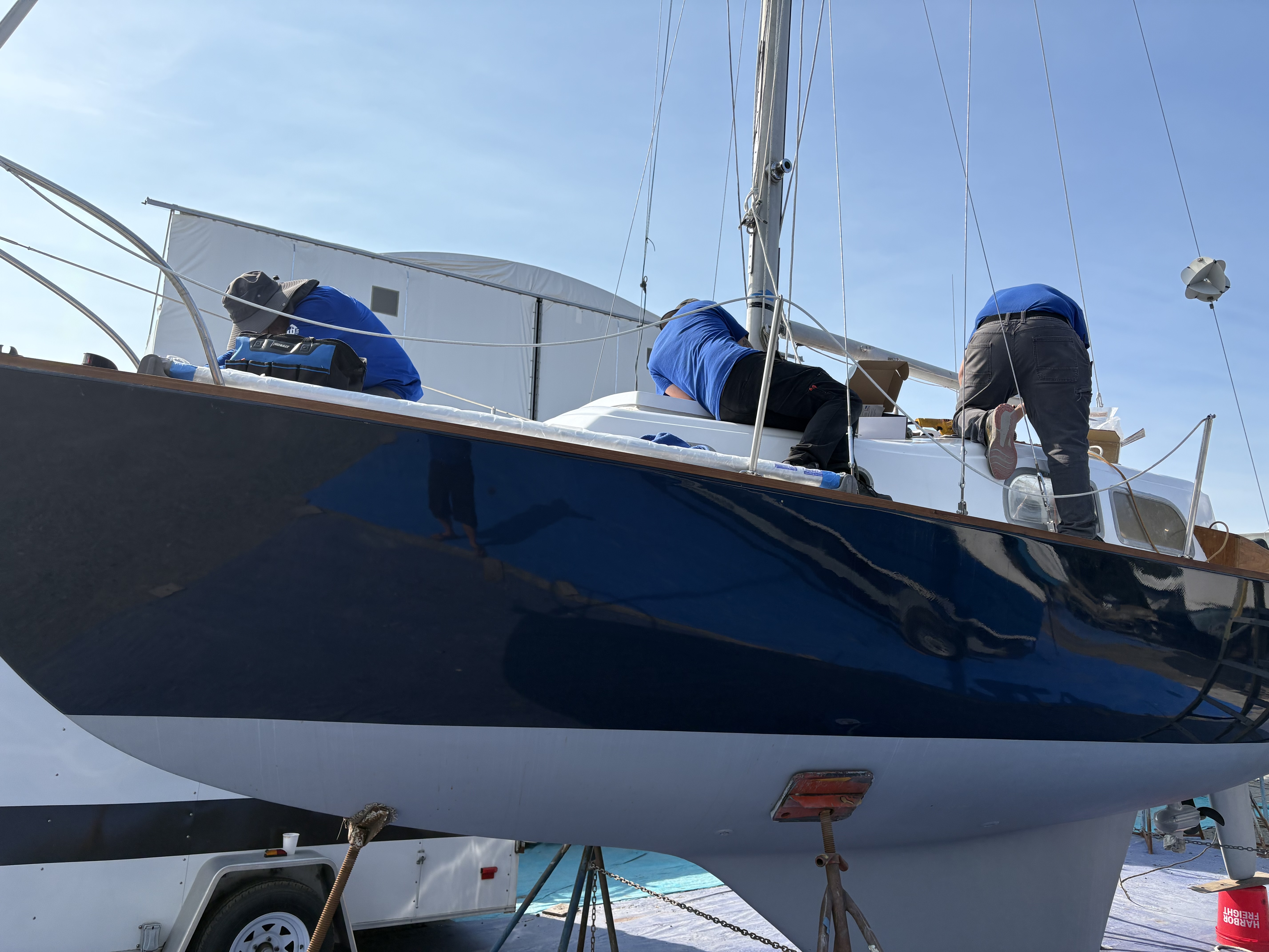Crew working on a fiberglass deck, Essential Shipyard