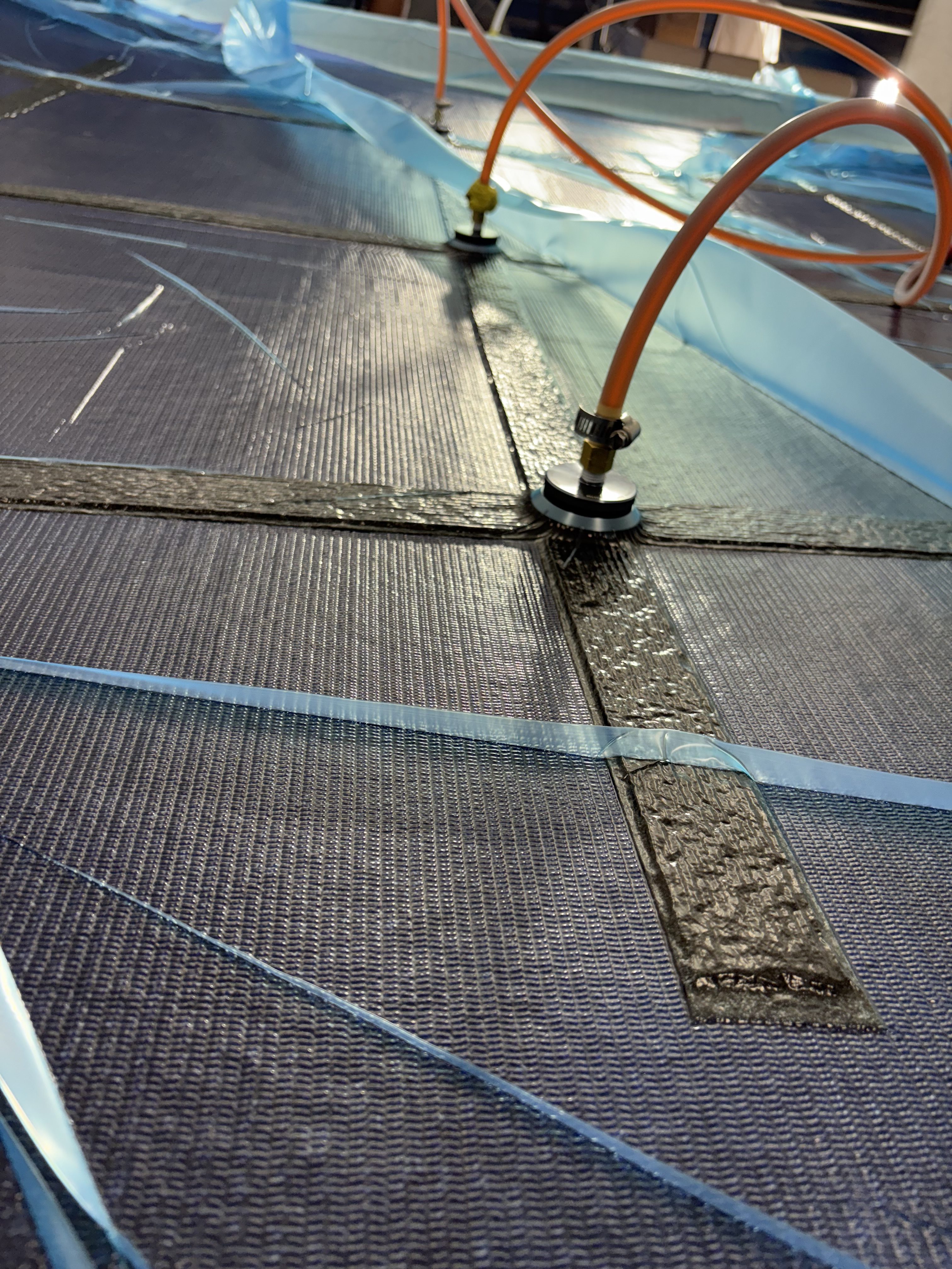 Resin front moving through dry laminate during infusion, Essential Shipyard
