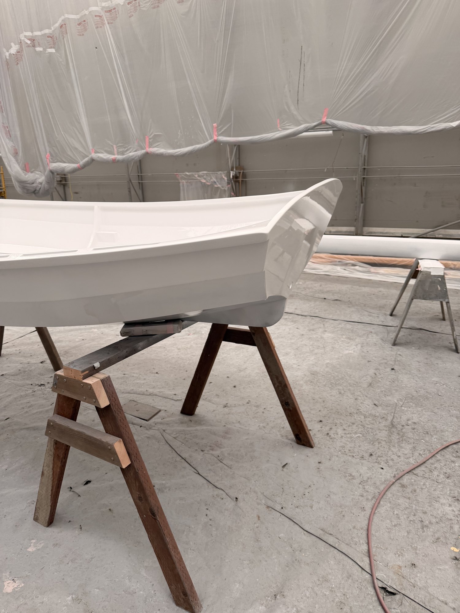 The same hull finished in Awlgrip, gloss showing along the sheer.