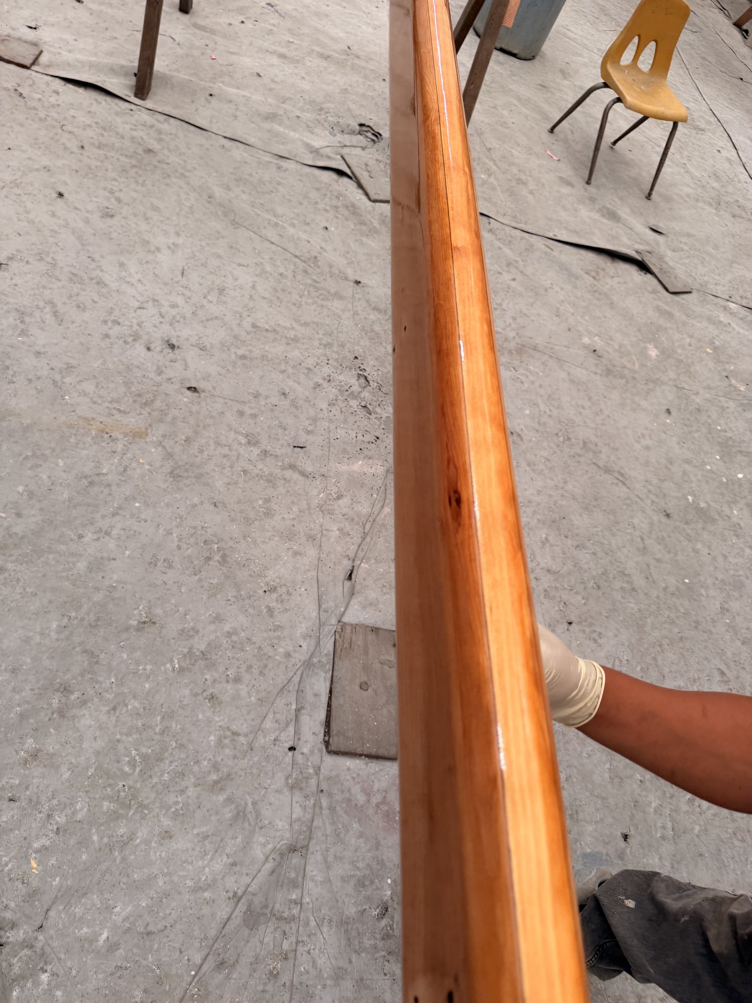 The repaired spar after fairing, with the finish going on.
